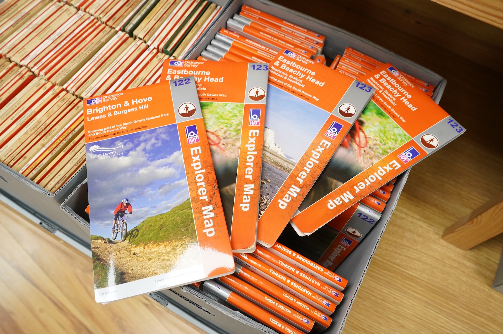 A collection of Ordnance Survey maps including Explorer series 1:25,000, Seventh Series One Inch, together with miscellaneous touring and historic editions (3 boxes)